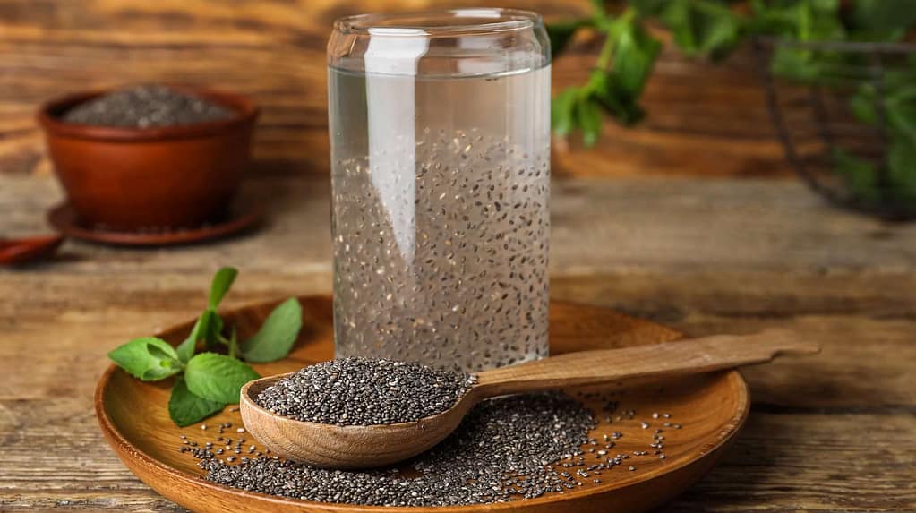 GlassWithDrinkAndChiaSeedsOnWoodenBackground MindViewMagazinecom