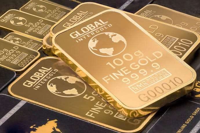 Photo by Michael Steinberg MindViewMagazinecom A detailed shot of gold bars labeled 'Global Intergold' as a symbol of wealth and investment.