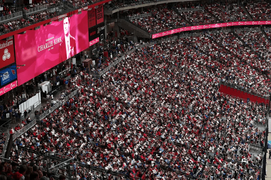 image MindViewMagazinecom Packed crowd at State Farm Stadium in Arizona attending the Charlie Kirk memorial service in September 2024